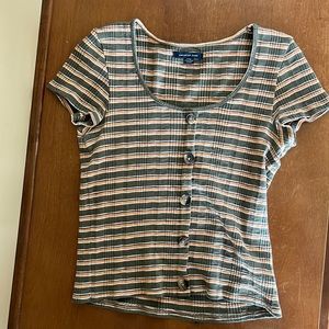 American Eagle shirt with buttons going down the front. It’s striped. Size:S